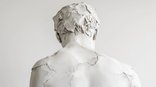 White ceramic Greek statue man in a museum