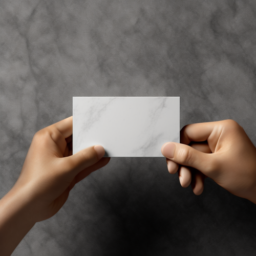 Business card being handed to a client