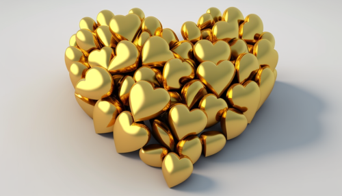 Small golden hearts on white background