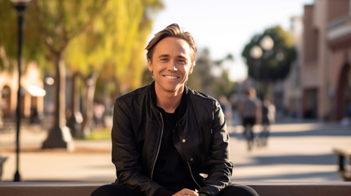 Jonathan Brandis smiling in sunny town square