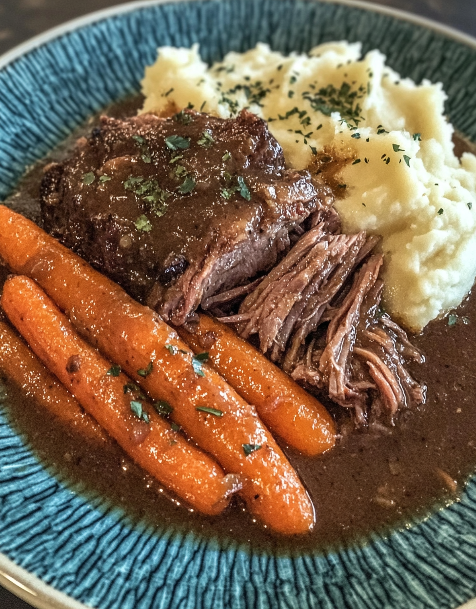 Amateur photo of pot roast with gravy and vegetables.