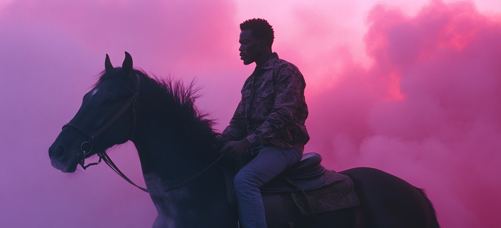 An African American Man Riding Black Horse