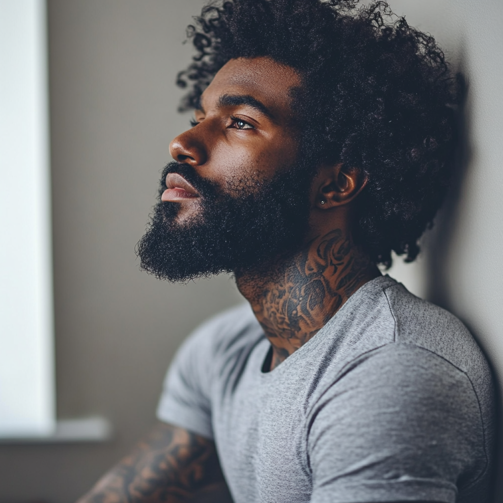 Athletic Black Man with Tattoos and Afro