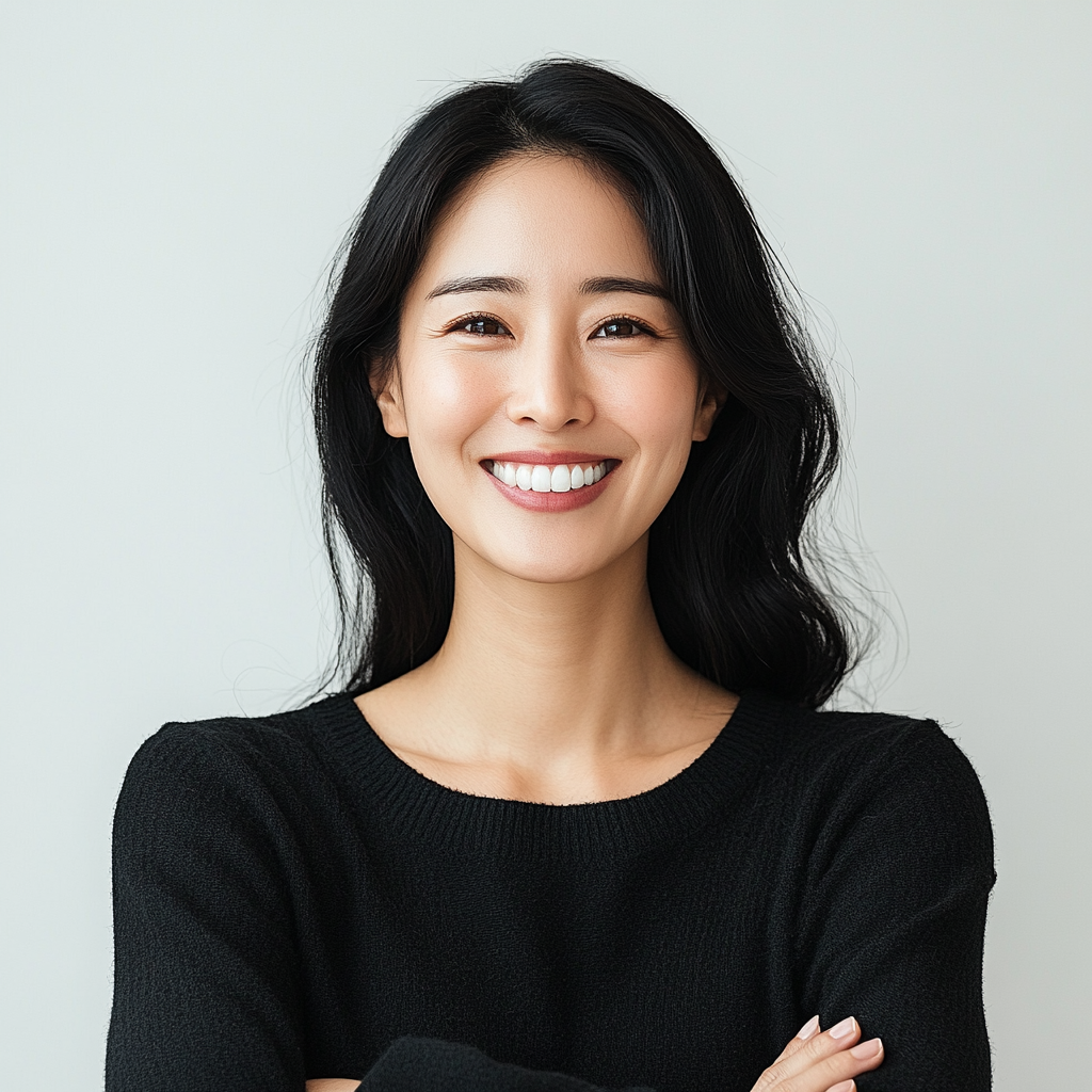 Korean woman in her 40s with confident smile.