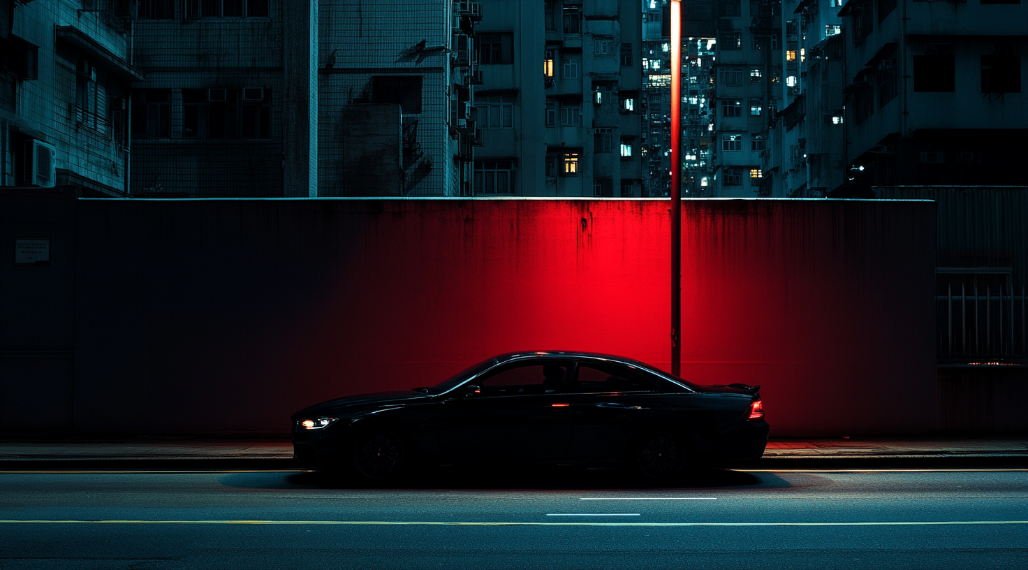 Silhouette of urban facade with car, human eye level.