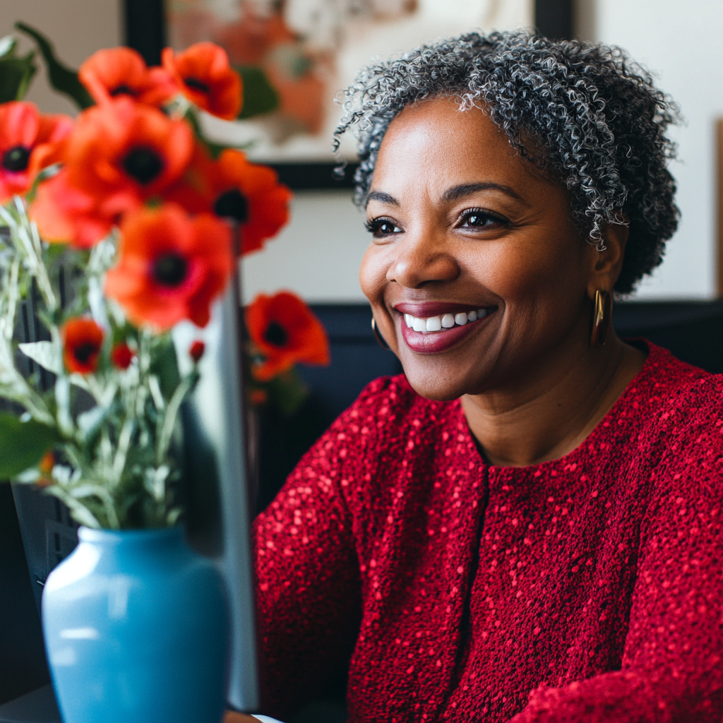 Smiling woman engaging in virtual meeting, building community.