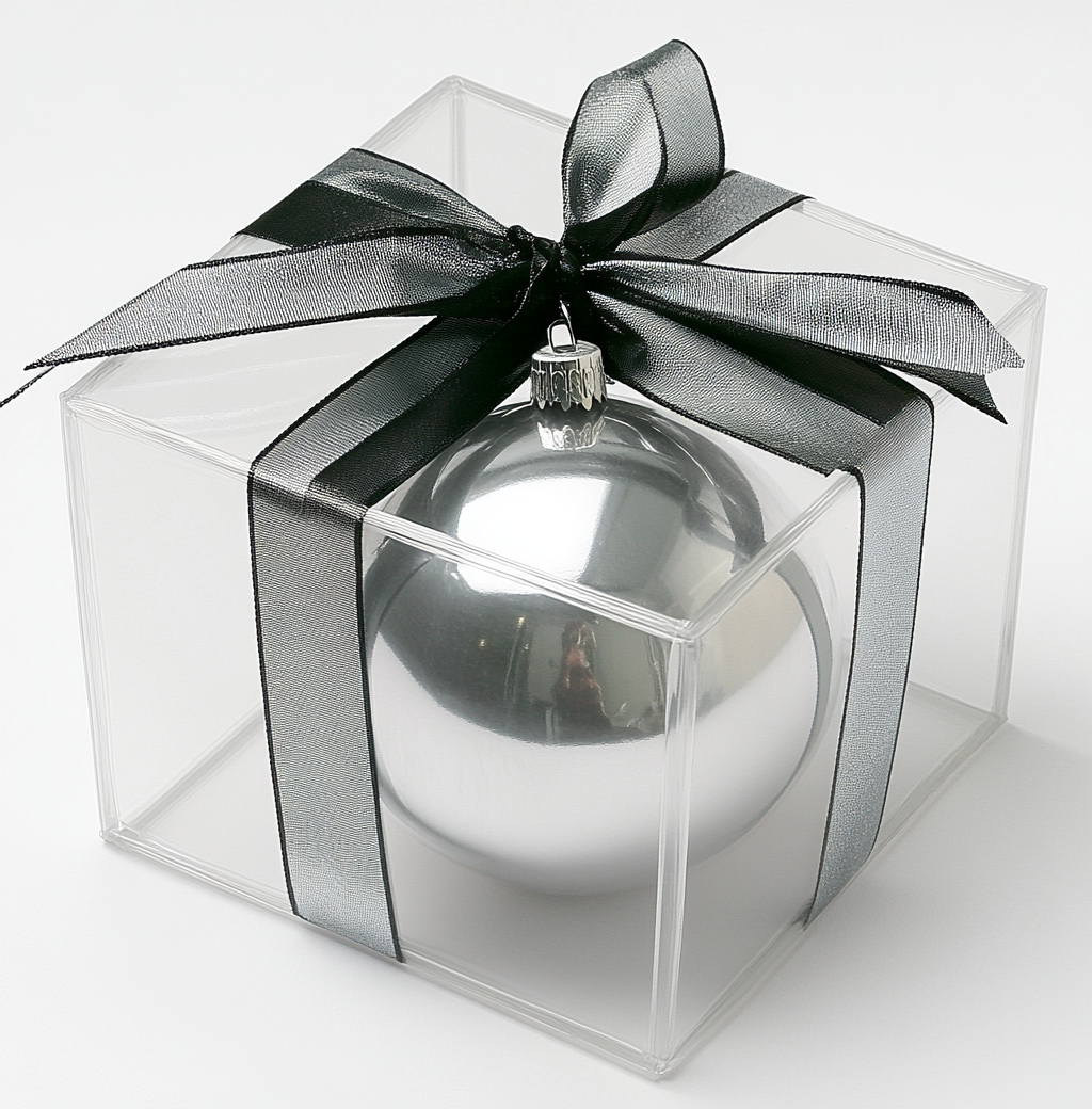 Transparent gift box with silver and black ribbon, christmas sphere.