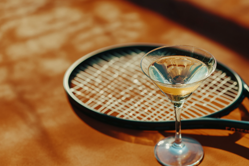 A Fancy Martini on Tennis Court in Afternoon