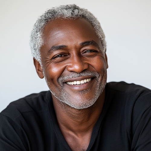 A Happy African Man Laughing Against White Background