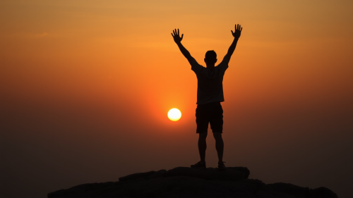 A Person Celebrating Sunrise Alone on Horizon