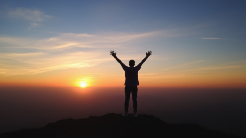 A Person Celebrating the Sunrise Alone