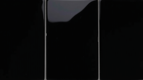 A Single Glossy Black Square Tile