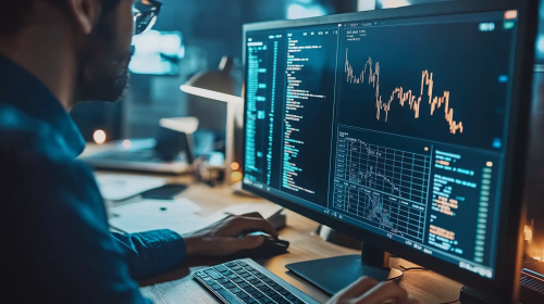 A finance worker on a computer screen.
