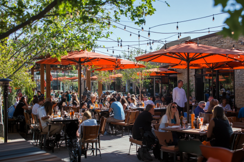 A lively restaurant with happy diners chatting