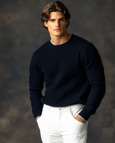 A man in blue sweater and white pants