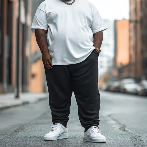 African American man in white shirt and pants