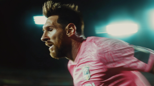 Close-up of Messi running in pink uniform Close-up of Messi running in pink uniform