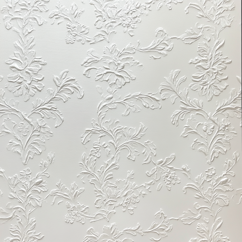 Close-up view of white wall for wallpaper display.
