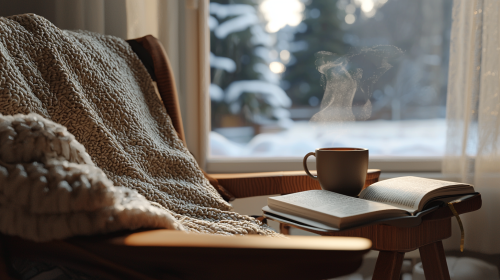 Cozy winter scene with armchair, blanket, and tea