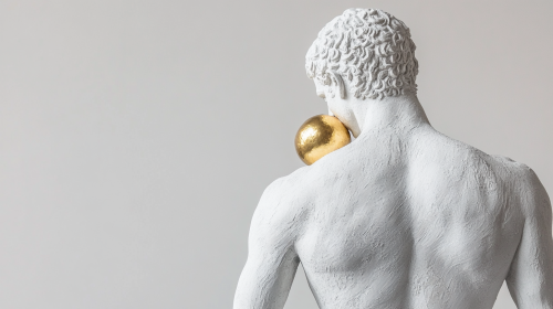 Greek Man hides golden apple in white statue