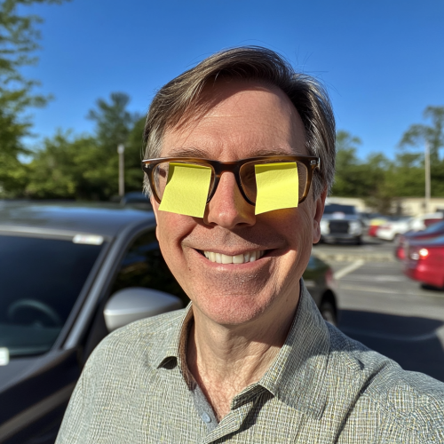 Middle aged man with post-it notes selfie 