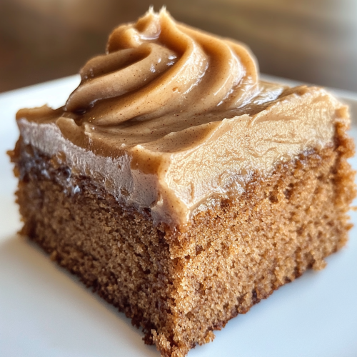 Moist Applesauce Cake Slice with Creamy Frosting