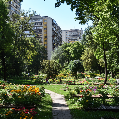 Nice park in Bucharest with kids playing, flowers, trees.