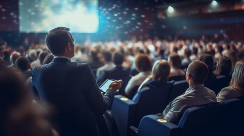 Realistic audience listening to corporate business speaker Realistic audience listening to corporate business speaker