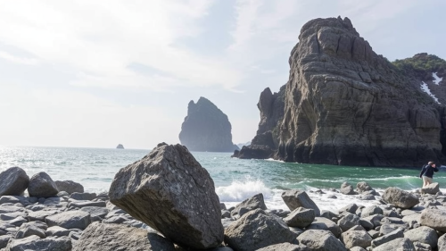 Rock formed by constantly flowing water in river bed.