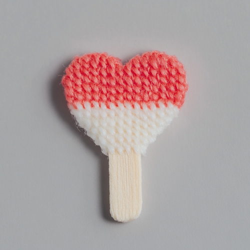 Two matchsticks forming heart shape, with burned effect.