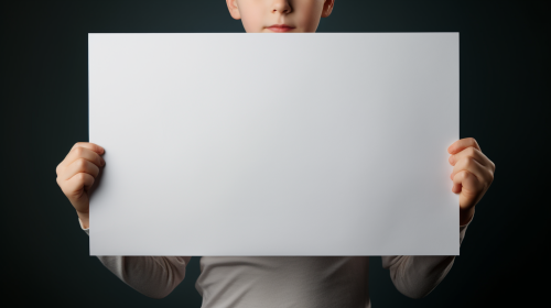 Child holding blank A3 sheet