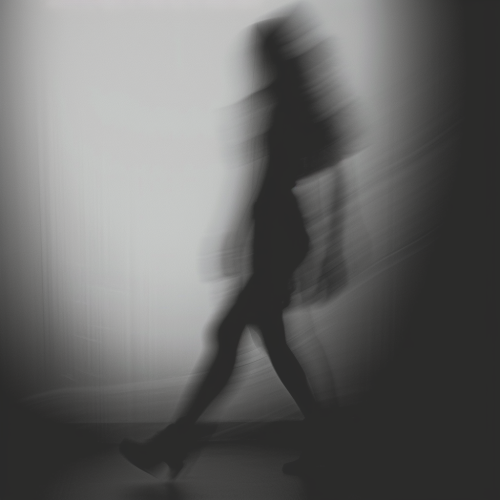 Blurry silhouette of woman in black and white