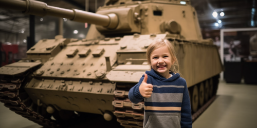 Child giving thumbs up to tank