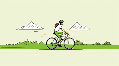 Young male on bicycle in mountain landscape
