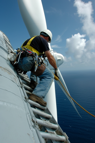 Offshore wind turbine worker climbing ladder
