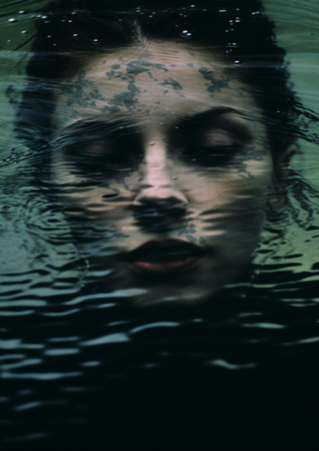 Woman with Face Semi-Submerged in Water