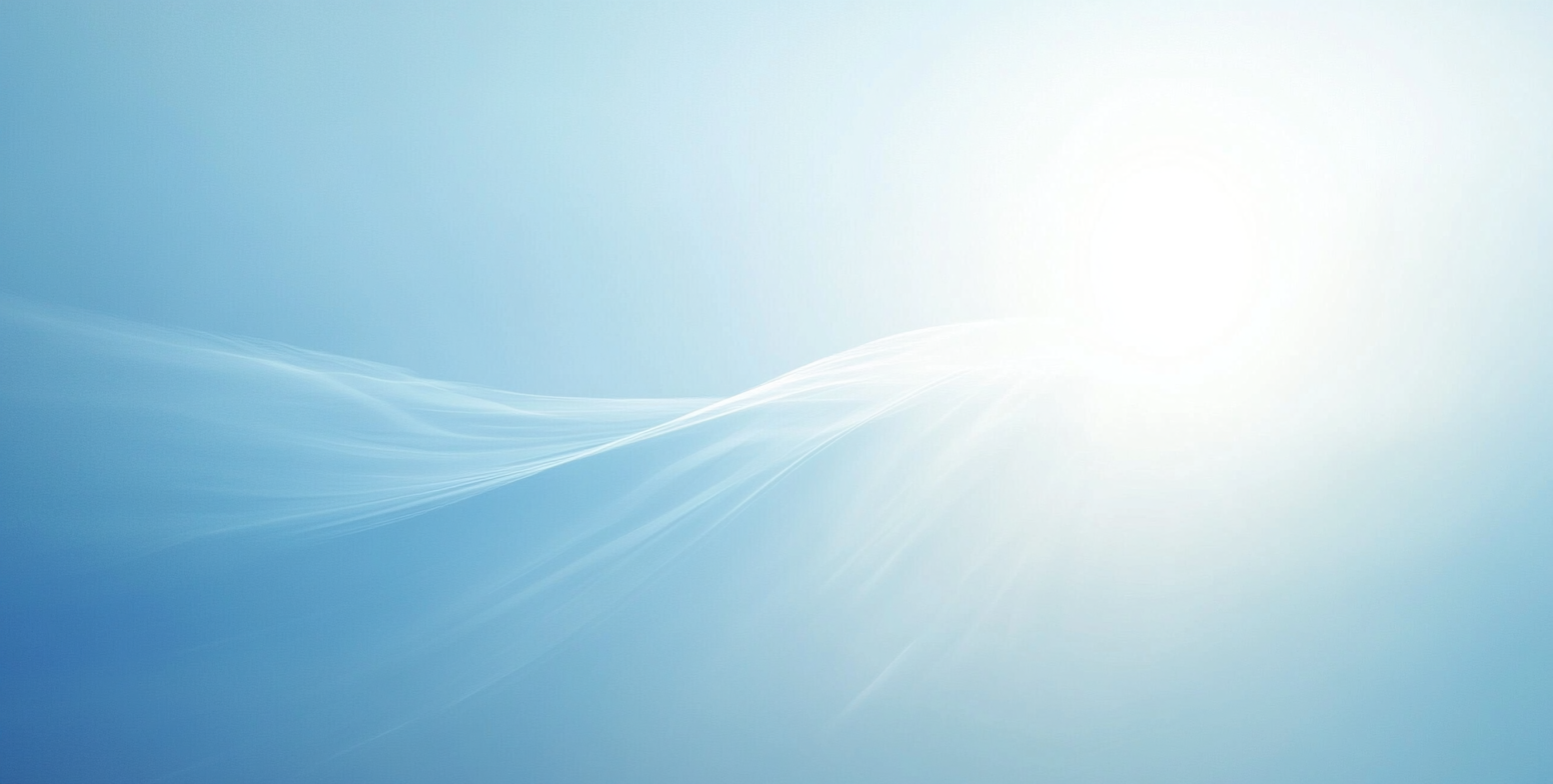 Abstract sunlight on soft blue background creates calm tranquility.