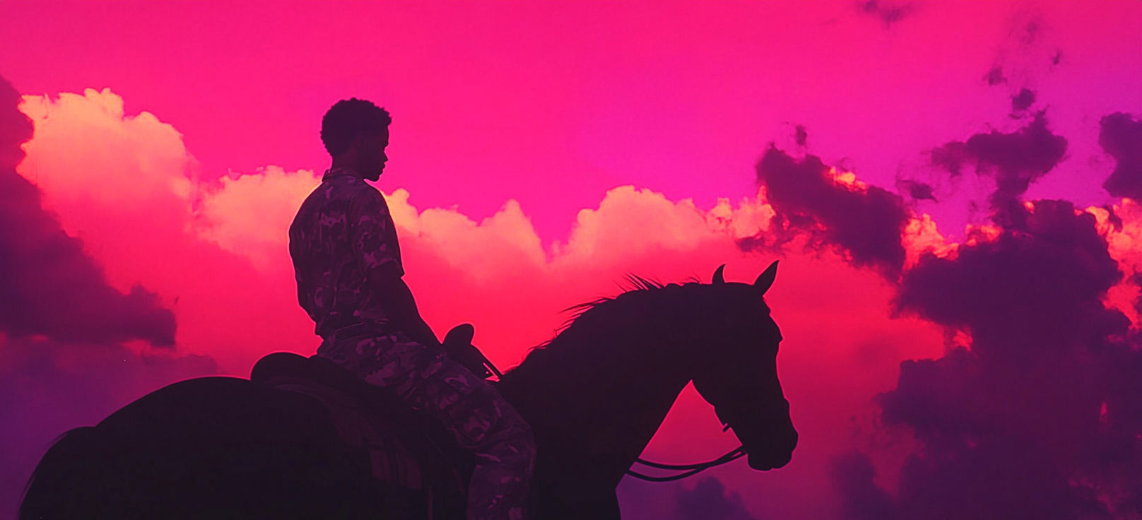 An African American Man Riding Black Horse