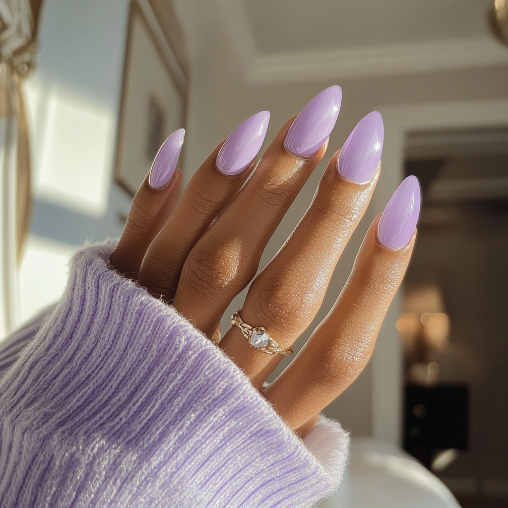 Candid photo of woman showing off new lavender nails.