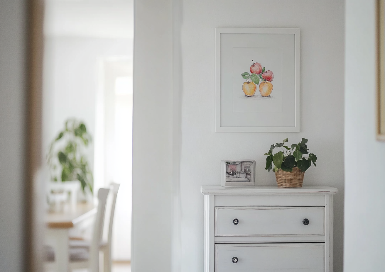 Entrance hall with child's painting on white dresser.