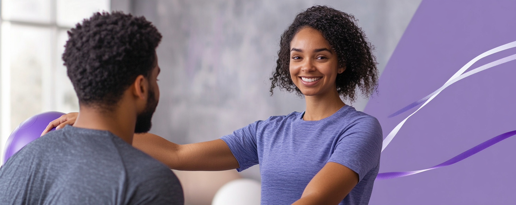 Female getting therapy from male in purple setting