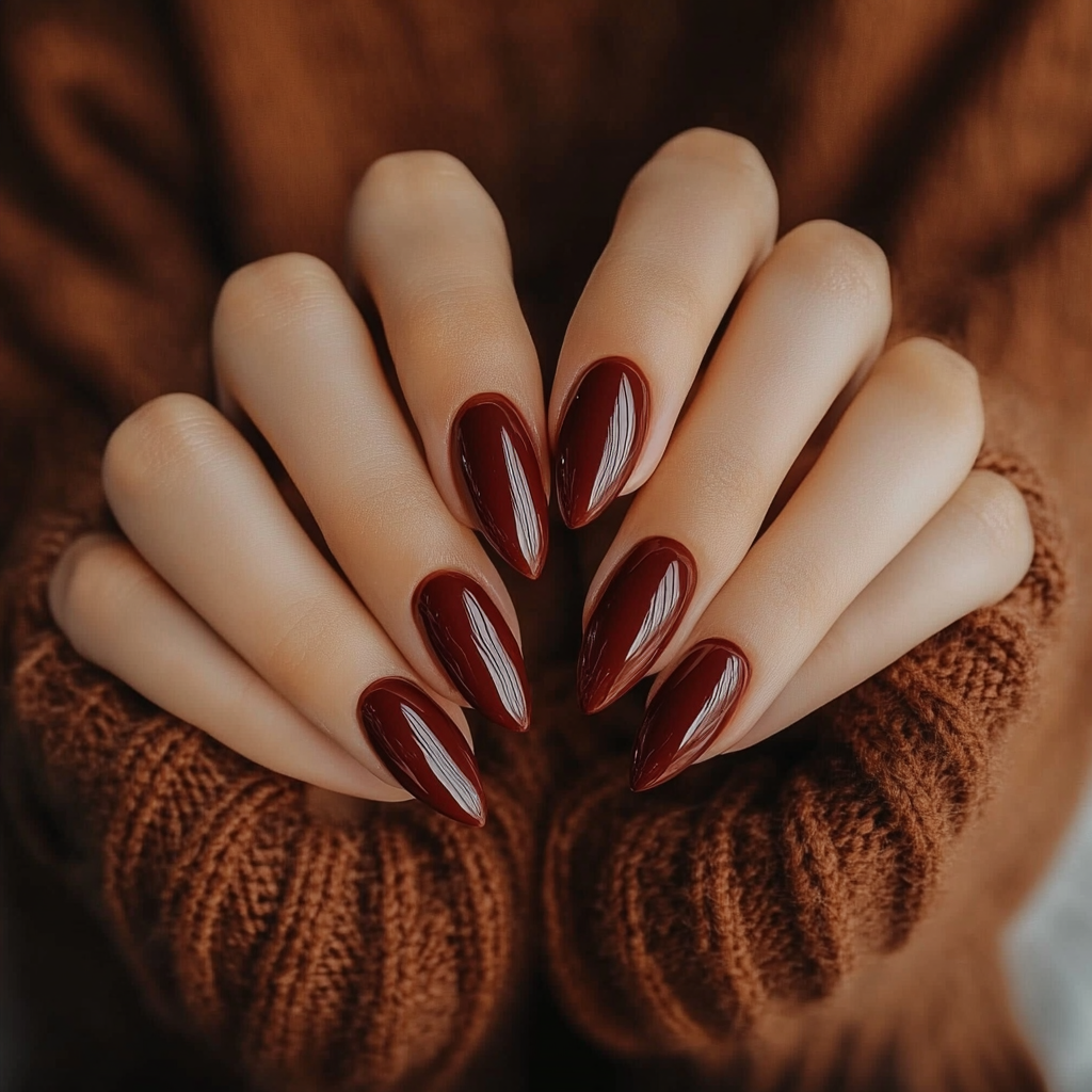 Photo of tan woman showing off new nails.