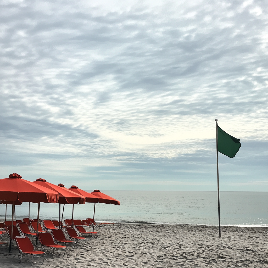 Red umbrellas and chairs on Long Island Beach.