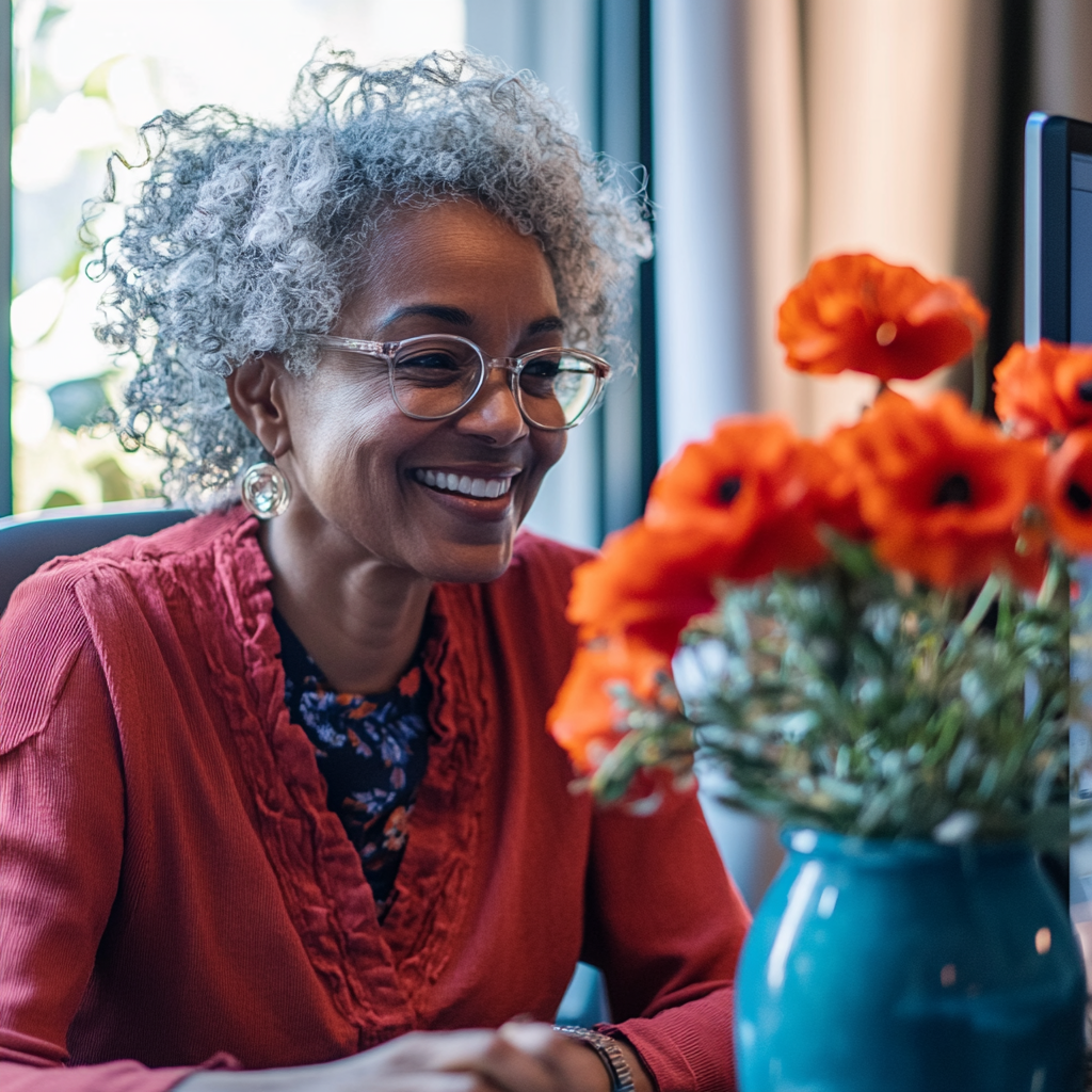 Smiling woman engaging in virtual meeting, building community.