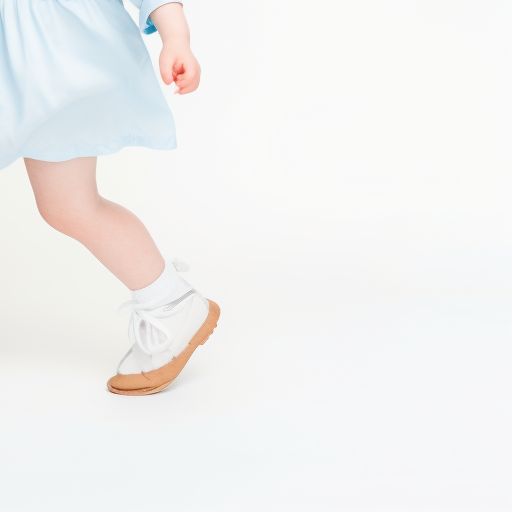 Cute little girl with wavy red hair walking