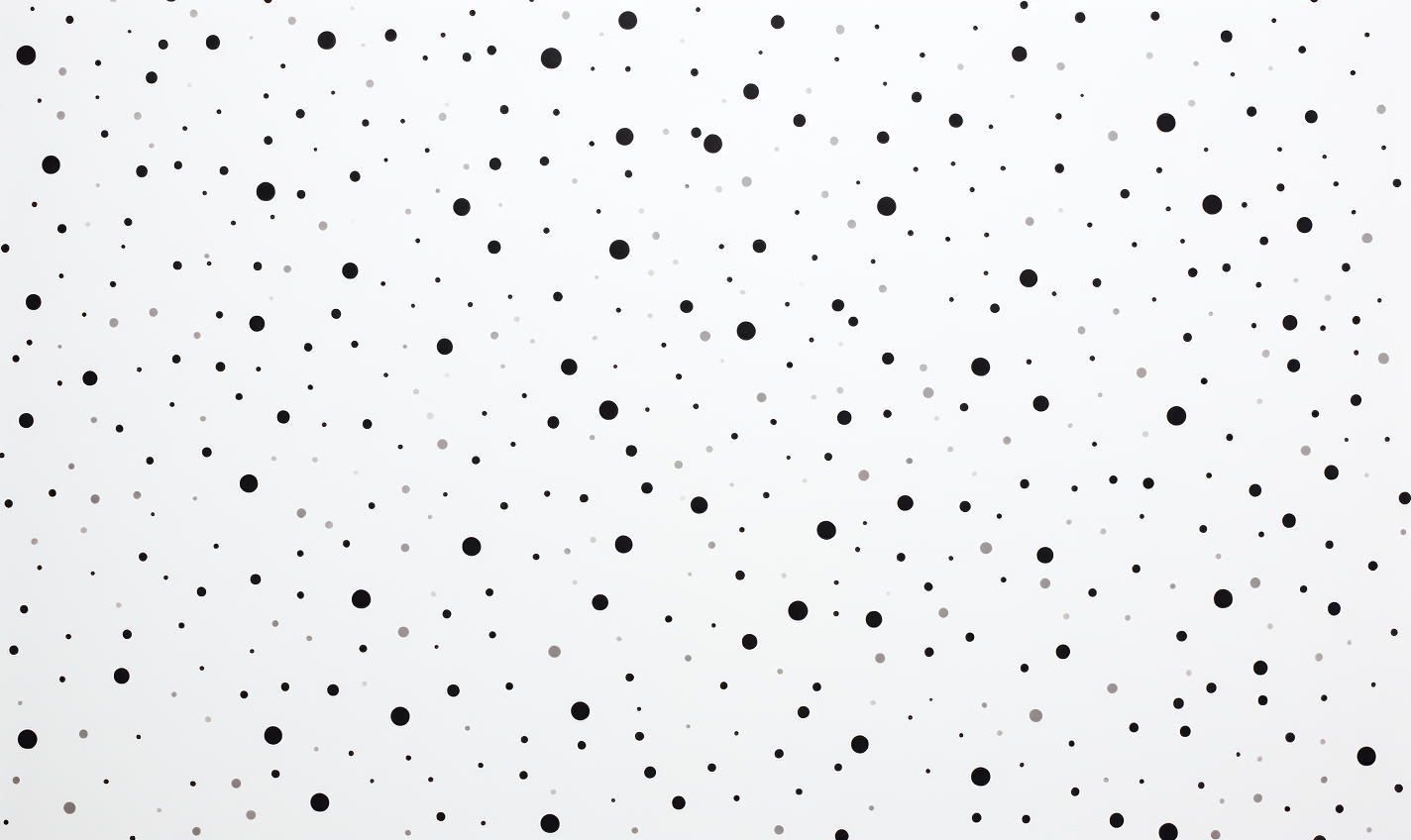 Abstract black dot pattern on white surface